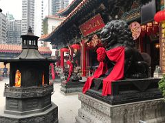 07D Chinese offering furnace and statues of a crane on the back of a dragon tortoise and a Chinese Imperial guardian lion outside the main hall at Wong Tai Sin temple Hong Kong